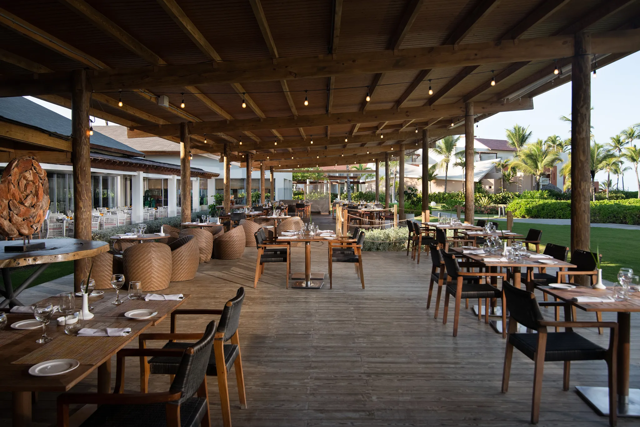 Carnival International Café buffet at Dreams Onyx Resort & Spa featuring open-air dining, diverse global cuisine stations, and a vibrant casual atmosphere.