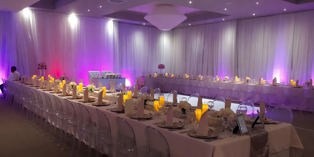 Joya Ballroom wedding reception setup with elegant décor and round tables at Dreams Onyx Resort & Spa