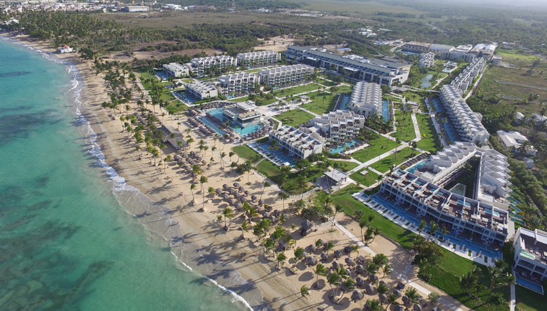 Excellence El Carmen adults-only all-inclusive luxury resort in Punta Cana with elegant pools, white sand beach, and refined atmosphere.