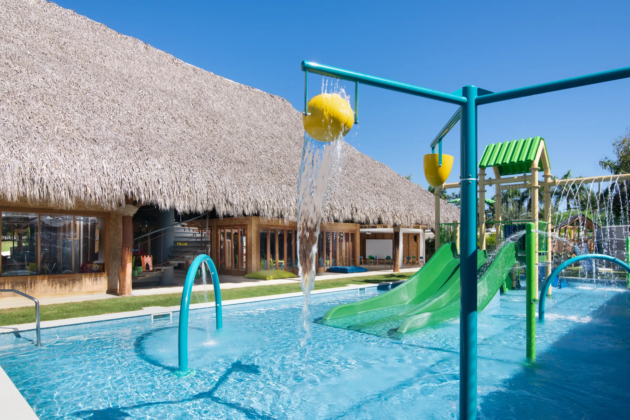 Kids splash zone with water features and slides at Explorer’s Club in Dreams Onyx Resort & Spa.