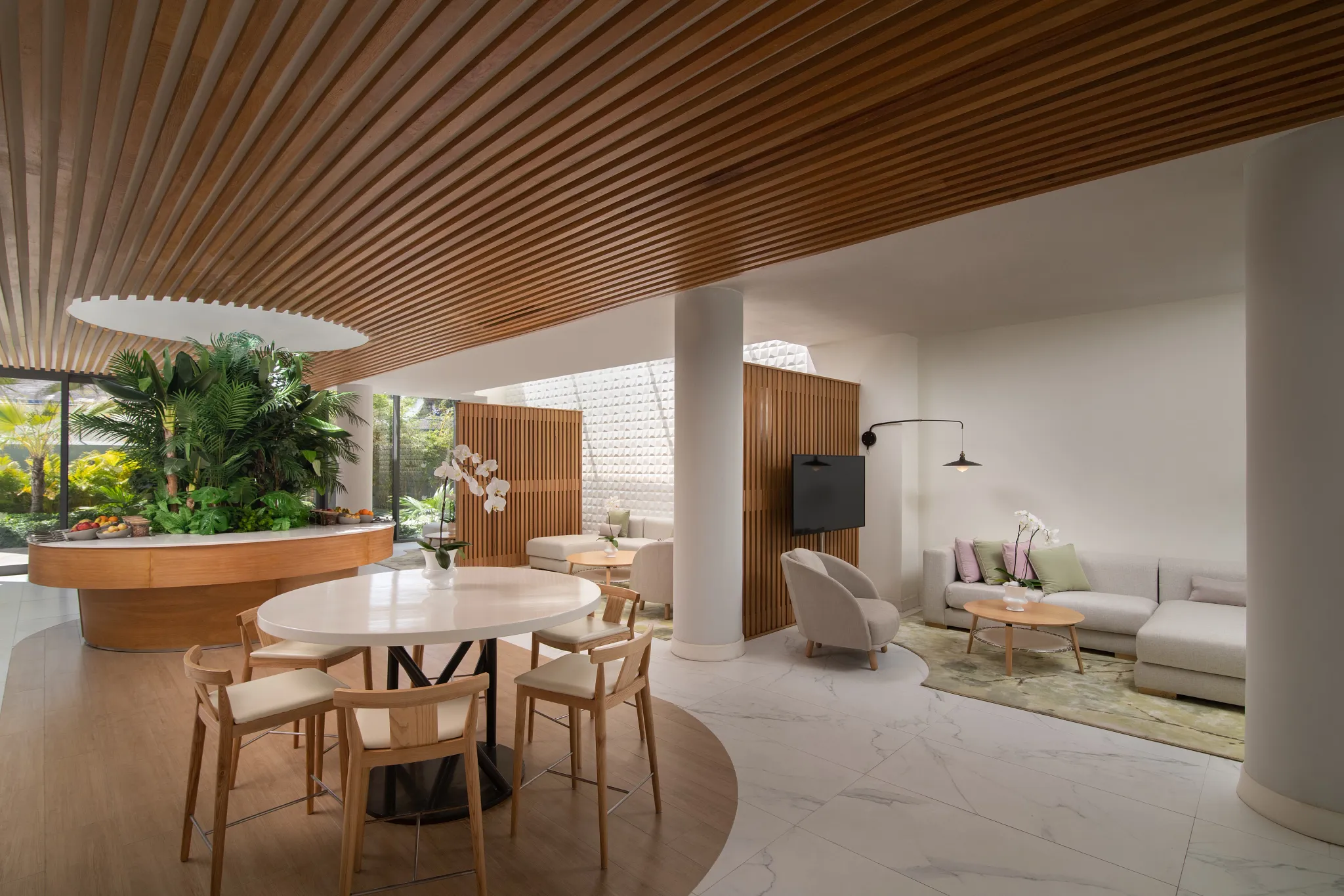 Modern family lounge area with seating and natural décor at Dreams Onyx Resort & Spa in Punta Cana.