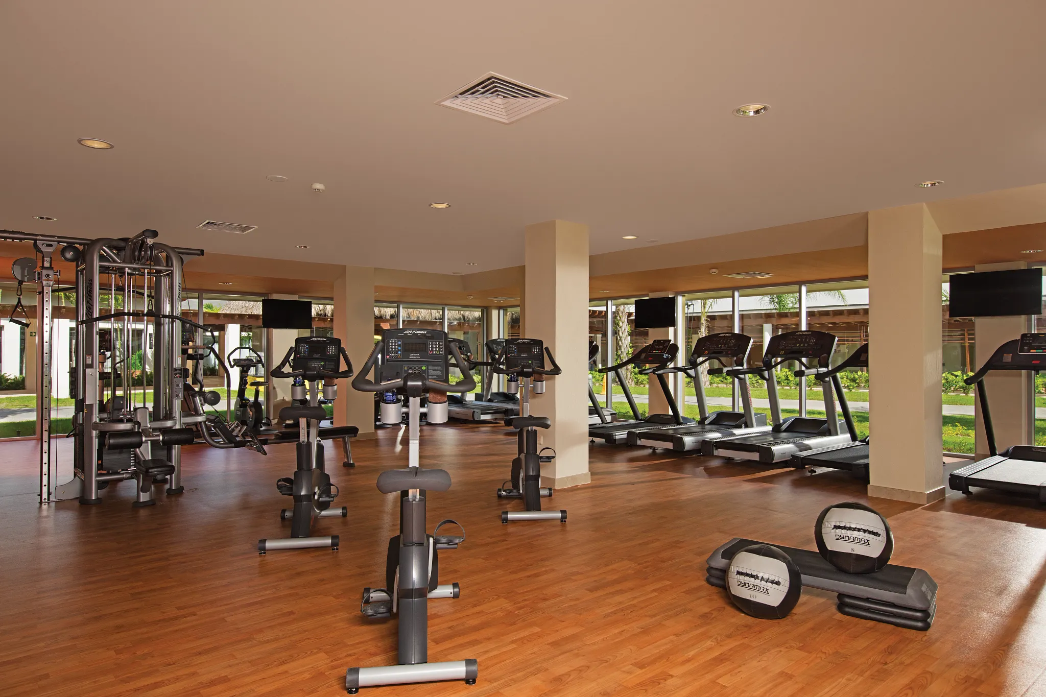 Modern fitness center with cardio and weight equipment at Dreams Onyx Resort & Spa.