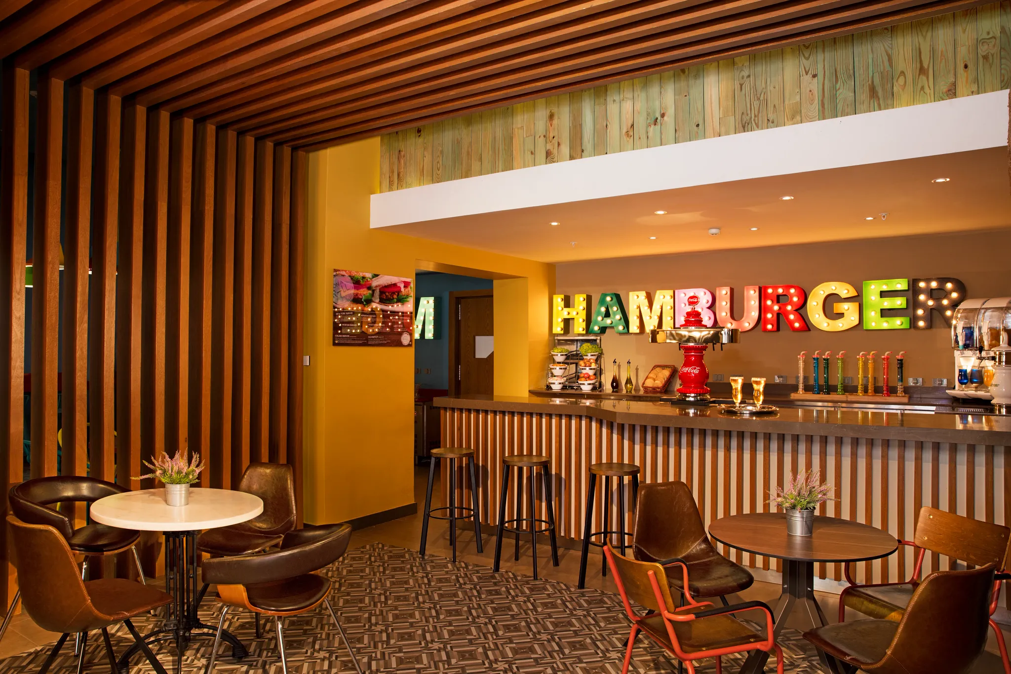 On a Roll Burger Bar at Dreams Onyx Resort & Spa serving gourmet burgers, casual outdoor dining, and late-night bites in a relaxed setting.