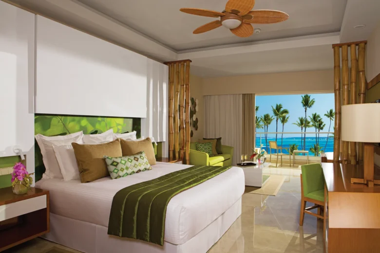 Preferred Club Junior Suite Ocean View with king bed and balcony overlooking ocean at Dreams Onyx Resort & Spa.