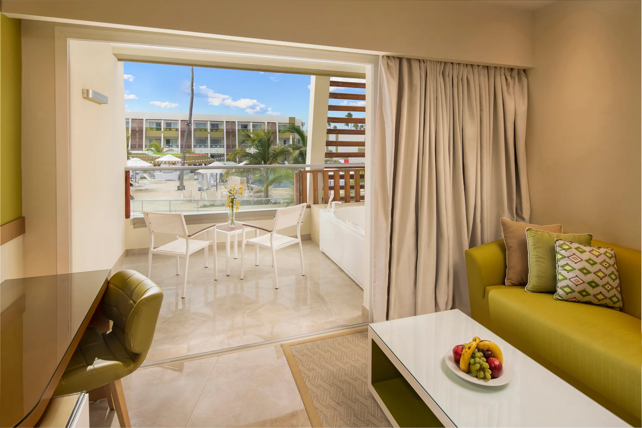 Preferred Club Junior Suite Pool View balcony with hot tub and seating at Dreams Onyx Resort & Spa.