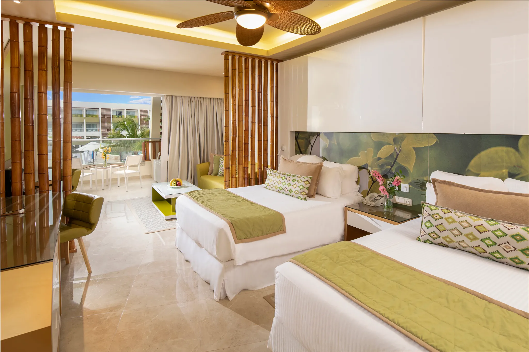 Preferred Club Junior Suite Pool View with two double beds and modern design at Dreams Onyx Resort & Spa.