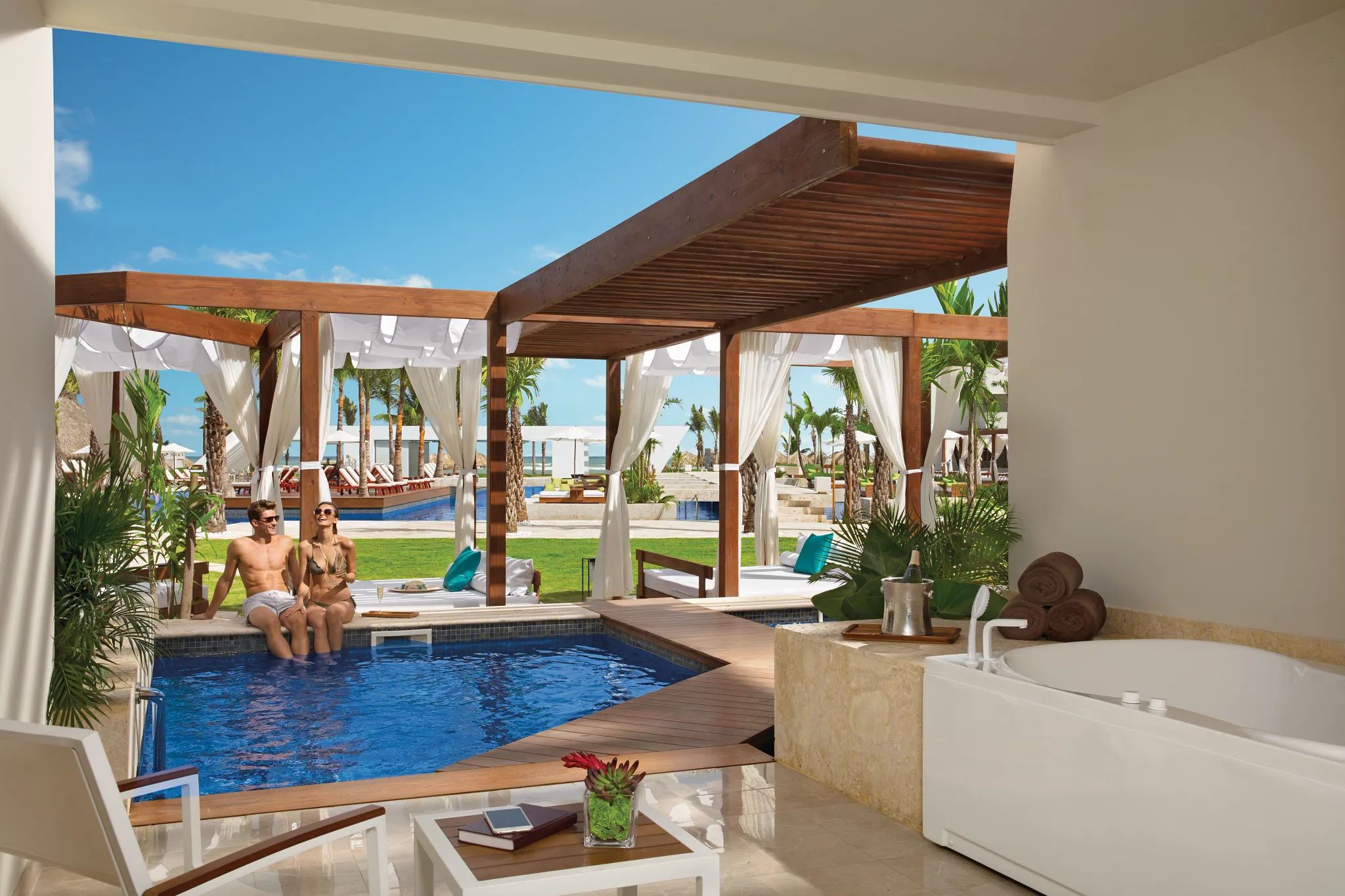 Private terrace with plunge pool and cabanas in Preferred Club Junior Suite Private Pool at Dreams Onyx Resort & Spa.