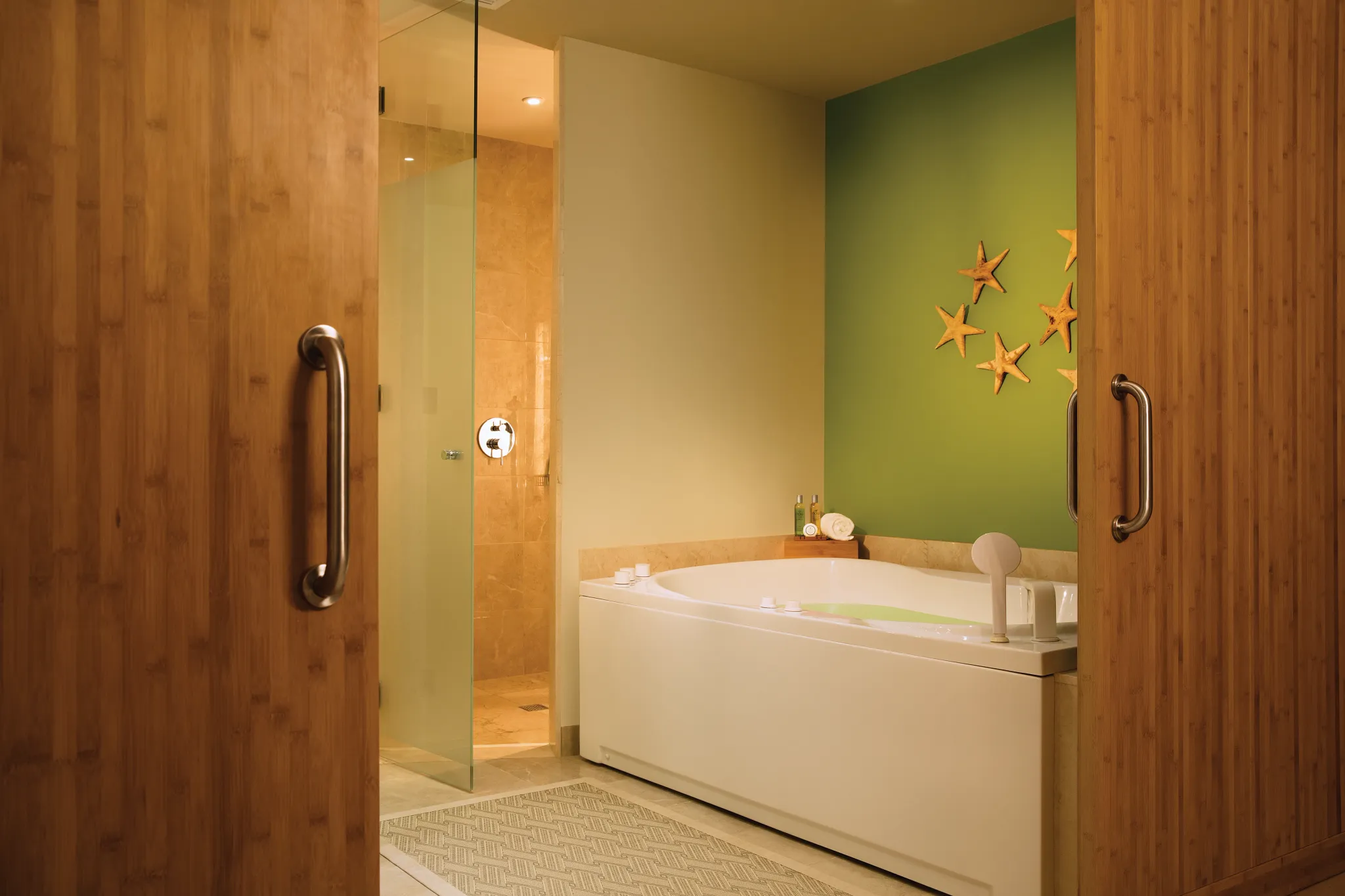 Bathroom with soaking tub and walk-in shower in Preferred Club Master Suite Ocean Front at Dreams Onyx Resort & Spa.