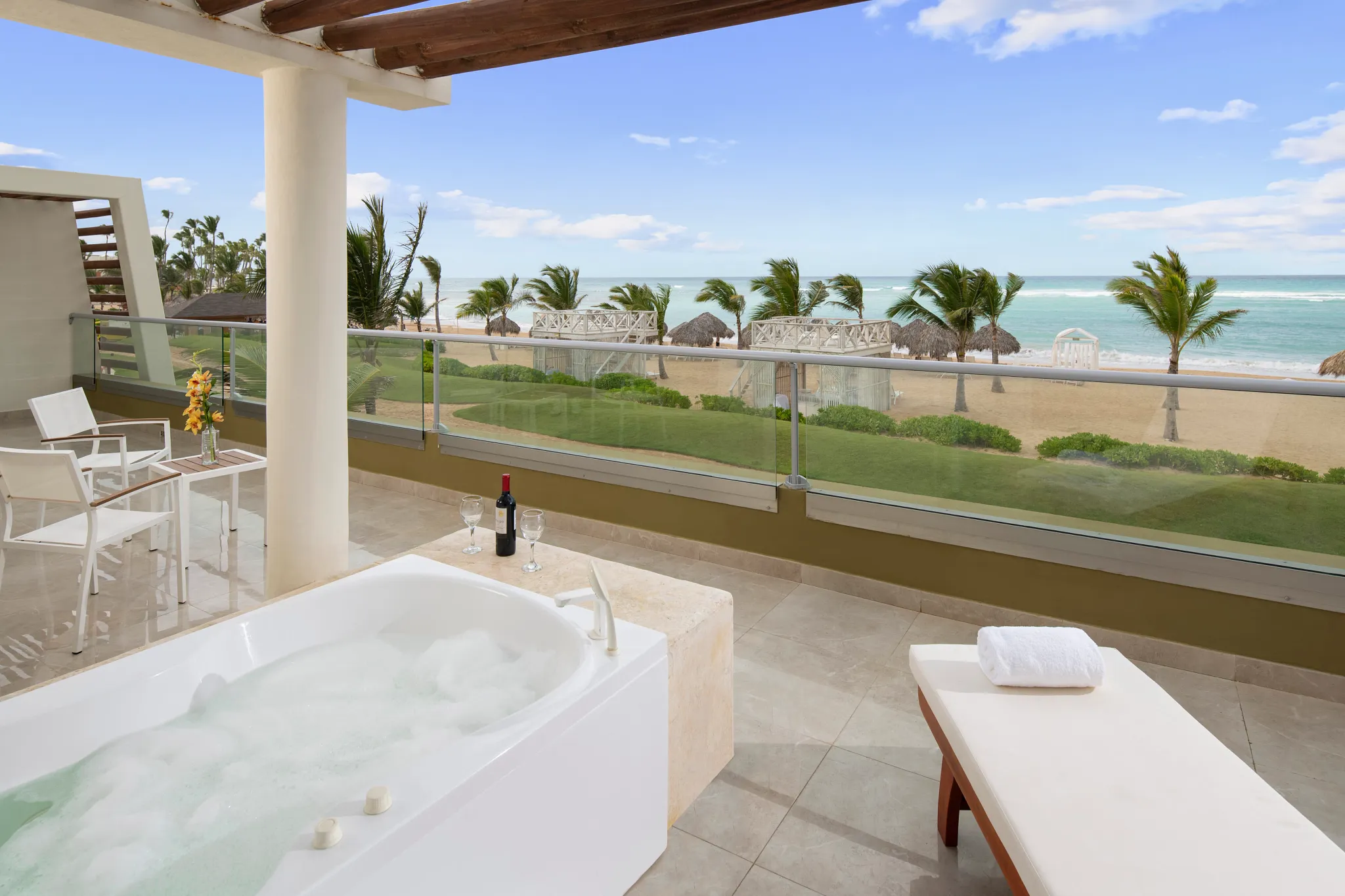 Oceanfront terrace with hot tub and seating in Preferred Club Presidential Suite at Dreams Onyx Resort & Spa.