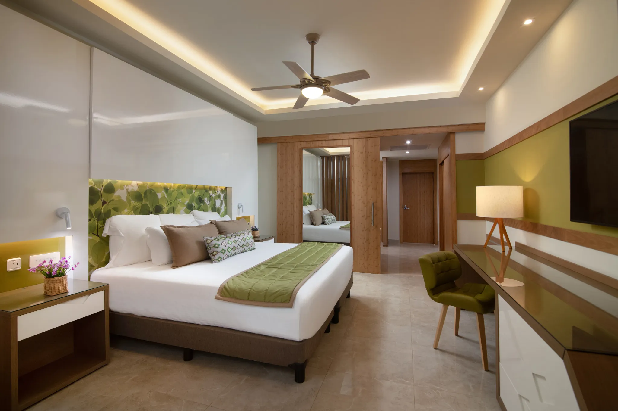 Premium Junior Suite Tropical View with king bed and workspace at Dreams Onyx Resort & Spa.
