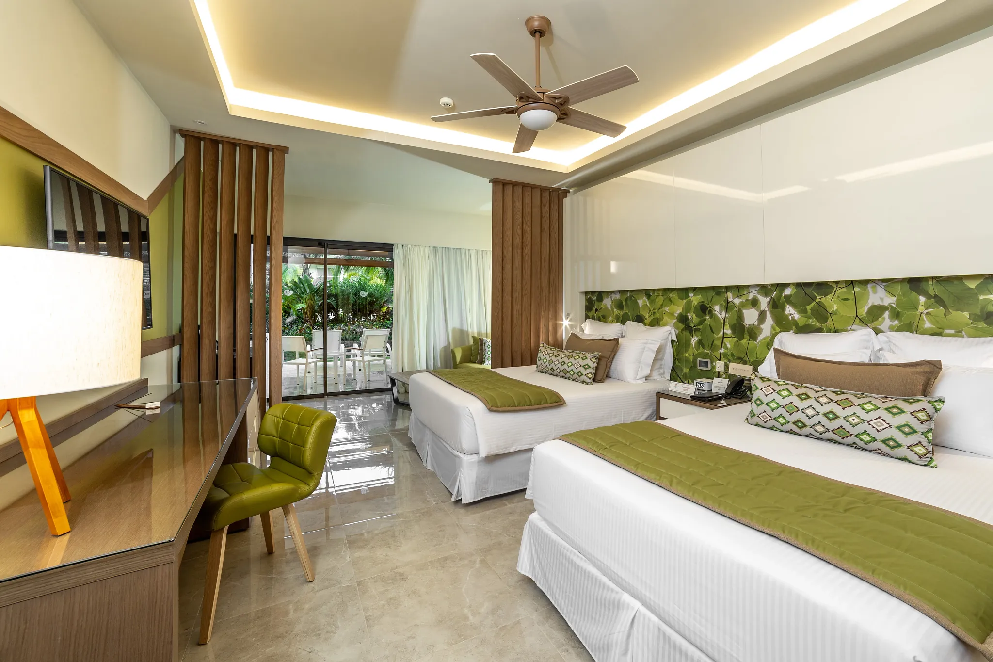 Premium Junior Suite Tropical View with two queen beds at Dreams Onyx Resort & Spa.